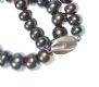 KNOTTED STRAND OF BLACK FRESH WATER PEARLS WITH A SILVER-TONE METAL CLASP at Ross's Online Art Auctions