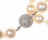 STRAND OF FRESHWATER PEARLS WITH 18CT WHITE GOLD AND DIAMOND BALL CLASP at Ross's Online Art Auctions