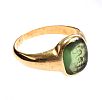 GOLD SIGNET RING WITH ENGRAVED GREEN STONE at Ross's Online Art Auctions