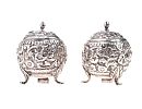 PAIR OF EMBOSSED SILVER PEPPER POTS at Ross's Online Art Auctions